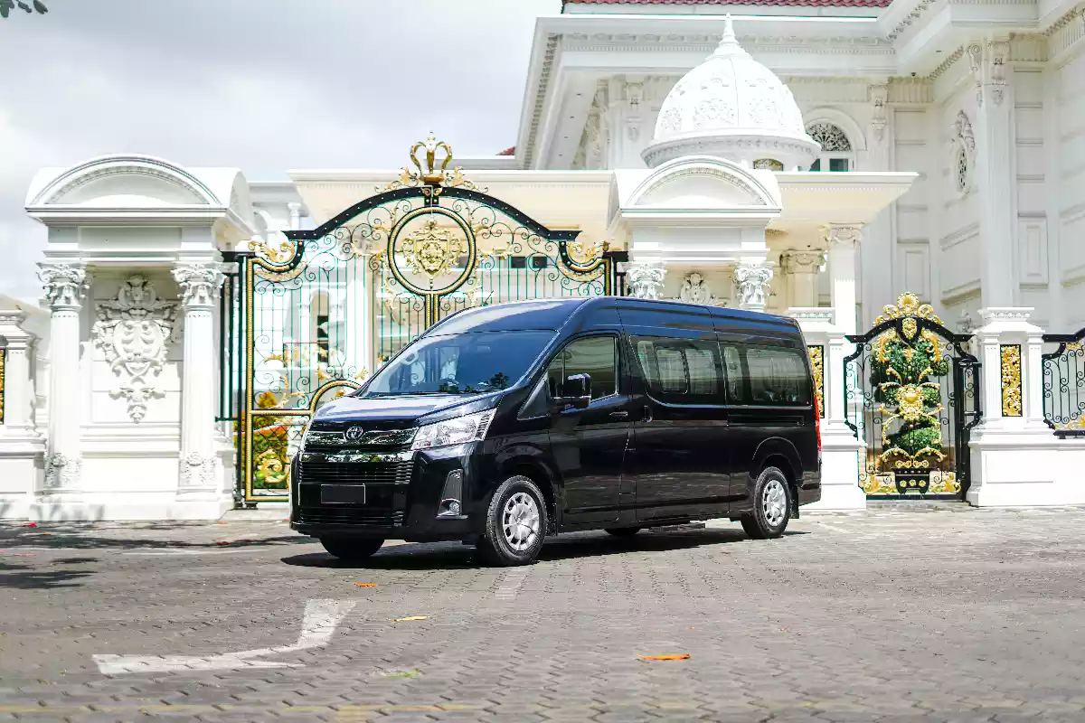 Black high-roof Toyota Hiace Premio seen from the side