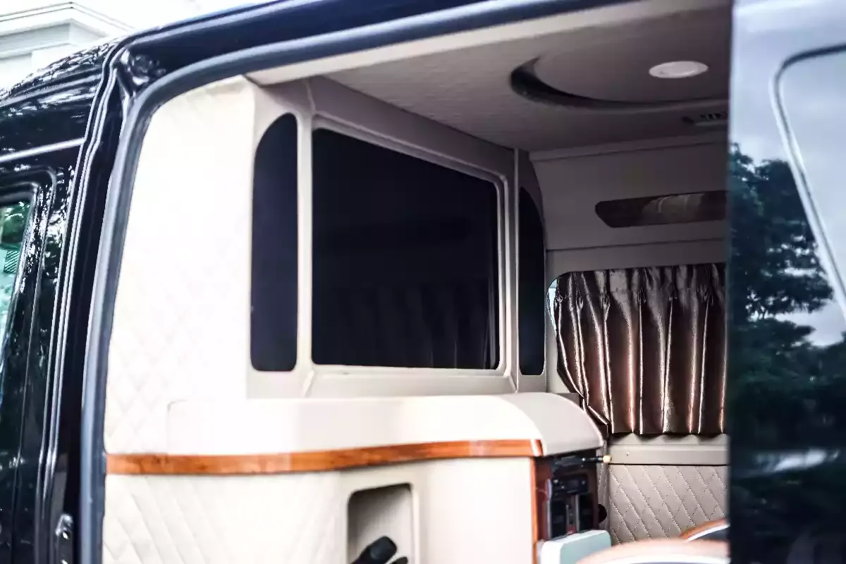 Hiace Premio rear cabin with curtained window and pale wood trim